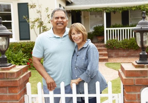 depositphotos 11884427 stock photo senior hispanic couple outside home