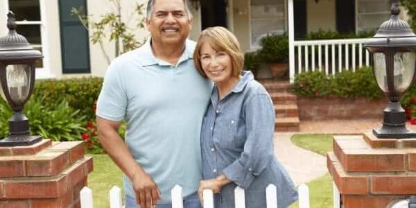 depositphotos 11884427 stock photo senior hispanic couple outside home